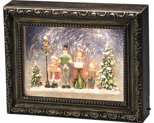 Dekoratives Weihnachtsbild mit Familie, Tannenbaum und Straßenlaterne in einem Bilderrahmen