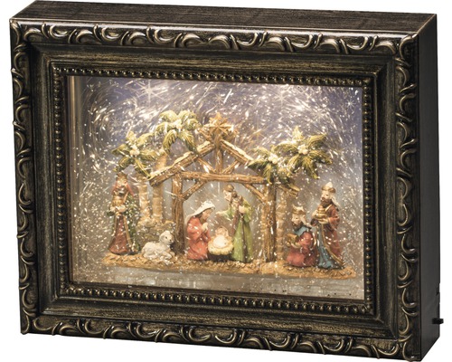 Weihnachtskrippe in einem Bilderrahmen mit Beleuchtung und Schneegestöber-Effekt.