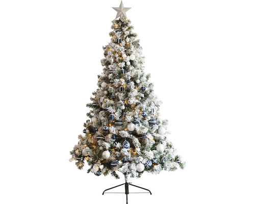 Geschmückter, schneebedeckter Weihnachtsbaum mit Sternspitze und Christbaumkugeln