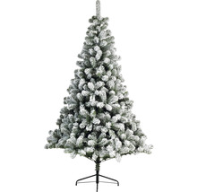 Künstlicher Weihnachtsbaum mit Schnee auf einem schwarzen Ständer