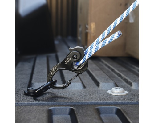 Nite Ize Logo. Ladungssicherung mit Seilspanner im Laderaum.