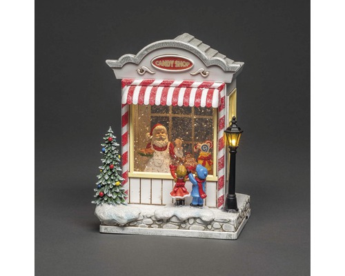 Weihnachtsdekoration: Süßwarenladen mit Weihnachtsmann und Kindern