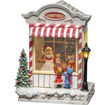 Dekorative Schneekugel mit Candy Shop, Weihnachtsmann und Kindern als Weihnachtsdekoration