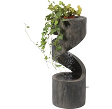 Dekorativer Zimmerbrunnen in Spiralform mit Bepflanzung