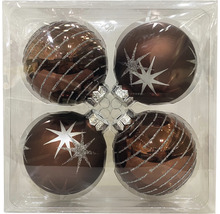 Vier Christbaumkugeln mit Sternen- und Linienmuster in Verpackung