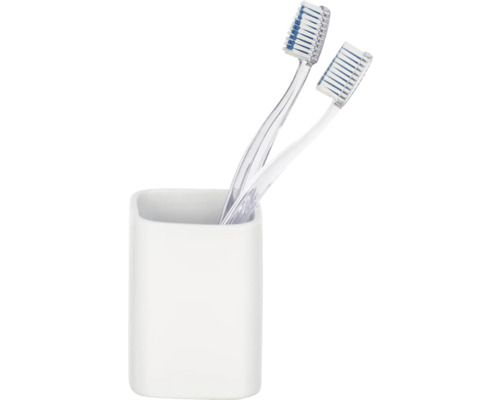 Zwei Zahnbürsten in weißem Zahnputzbecher
