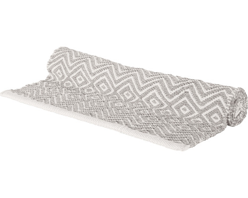 Gerollter Teppich mit geometrischem Muster