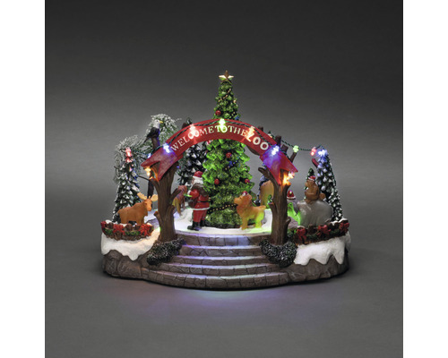Dekorative Weihnachtszoo-Szene mit Weihnachtsbaum, Figuren und Beleuchtung