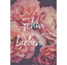 Rosen-Dekoration mit dem Schriftzug: Wer schön sein will, muss lachen.