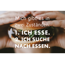 "Ein Burger wird von zwei Händen gehalten