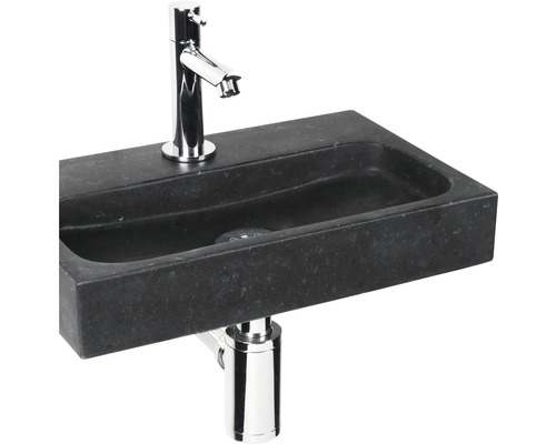 Waschtisch aus Stein mit Wasserhahn und Siphon