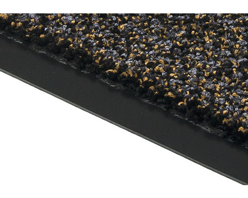 Detailansicht einer Fußmatte mit grober Textur und schwarzem Rand