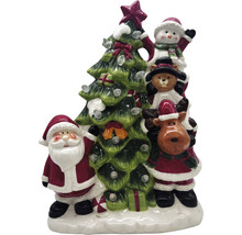 Weihnachtsdekoration mit Weihnachtsmann, Schneemann, Teddybär, Rentier und Weihnachtsbaum