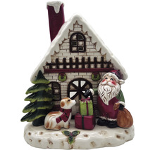 Dekorative Weihnachtsszene mit Haus, Weihnachtsmann, Hund und Geschenken