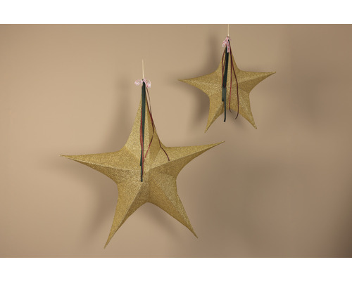 Zwei glitzernde Sterne als Dekoration für die Weihnachtszeit