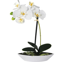 Künstliche Orchidee im weißen Topf