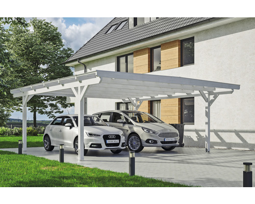 Doppelcarport aus Holz mit zwei Autos auf einem gepflasterten Hof