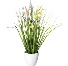 Kunstpflanze mit Gräsern und Blüten in einem Topf