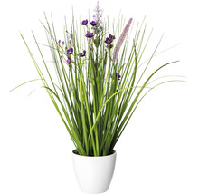 Kunstpflanze mit lila Blüten im Topf