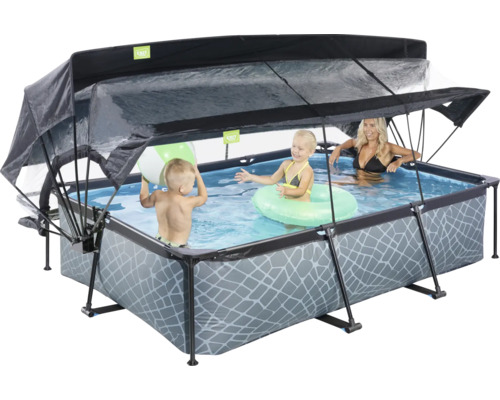 Rechteckiger Aufstellpool mit Überdachung und spielenden Kindern im Wasser.