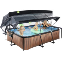 Schwimmbecken mit Überdachung und spielenden Personen im Wasser