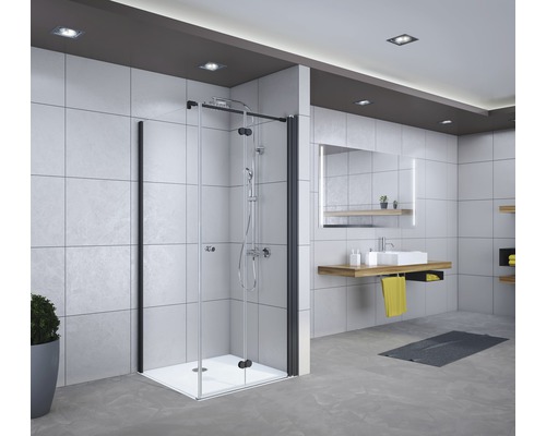 Badezimmer mit Duschkabine, Waschbecken und Spiegel