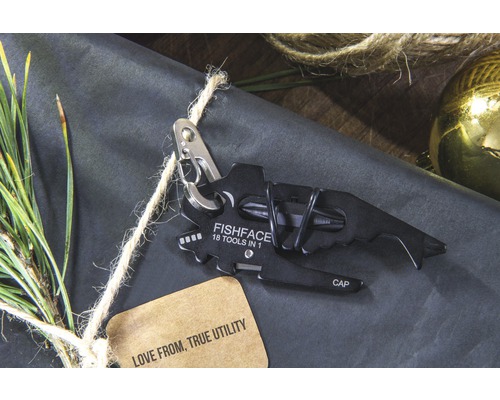 Multitool im Fischdesign mit 18 Funktionen auf Geschenkpapier