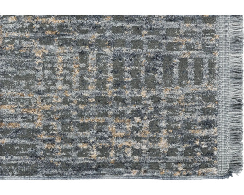 Detailansicht eines gemusterten Teppichs mit Fransen