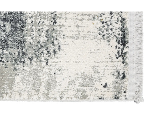 Teppich mit abstraktem Muster und Fransen