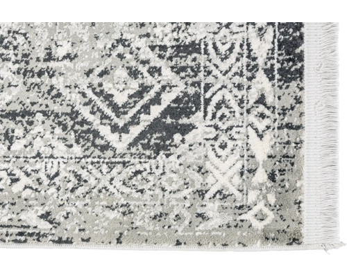 Teppich mit abstraktem Muster und Fransen