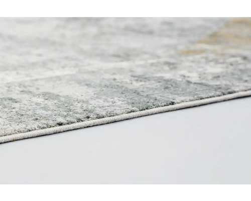 Detailansicht eines grauen Teppichs mit abstraktem Muster