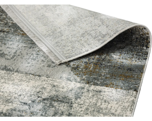 Grauer Teppich mit abstraktem Muster