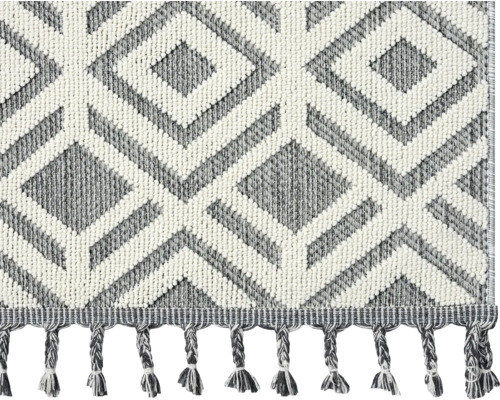Teppich mit Rautenmuster und Fransen