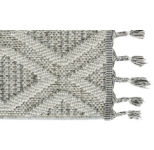 Teppich mit geometrischem Muster und Fransen