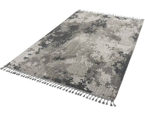 Teppich mit abstraktem Muster und Fransen