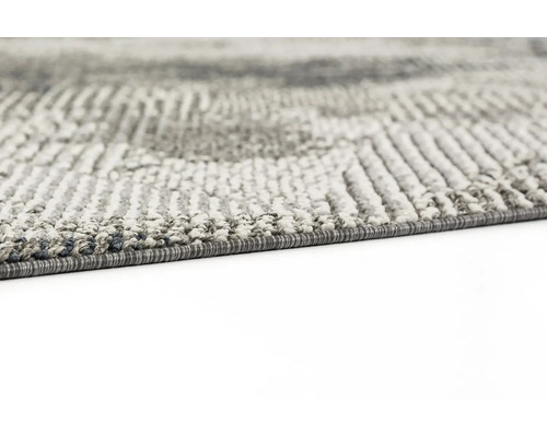 Detailansicht eines grauen Teppichs mit Muster