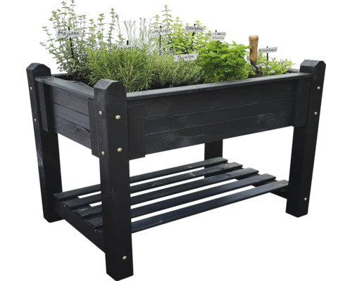 Hochbeet aus Holz mit Kräutern und Ablagefläche