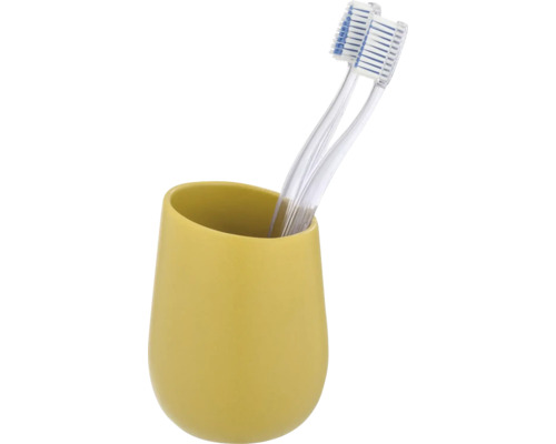 Zwei Zahnbürsten in gelbem Zahnputzbecher