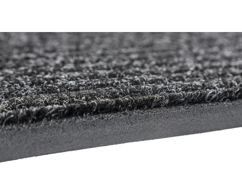 Nahaufnahme einer grauen Fußmatte mit Textiloberfläche und Gummirand