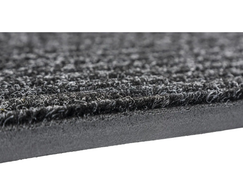 Detailaufnahme einer Fußmatte mit Textiloberfläche und Gummibeschichtung