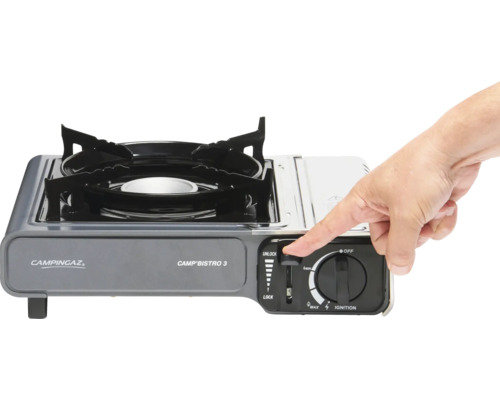Campingaz Camp''Bistro 3 Gaskocher mit Hand am Bedienknopf