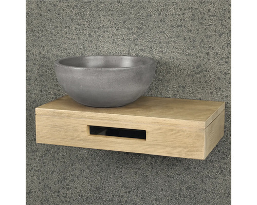 Waschbecken aus Beton auf einem Holzregal