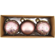 Drei Weihnachtskugeln in einer Verpackung