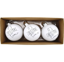 Drei weiße Weihnachtskugeln mit der Aufschrift Es ist Weihnachtszeit in einer Pappschachtel