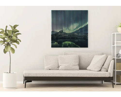Wandbild mit Berglandschaft über Sofa im Wohnraum