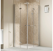 Eckdusche mit Drehtüren und Handtuchhalter im Badezimmer.