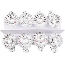 Acht Baumkerzenhalter aus Metall