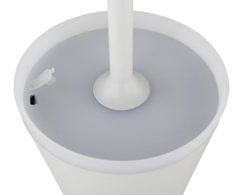 Detailaufnahme einer weißen Toilettenbürste mit Behälter.