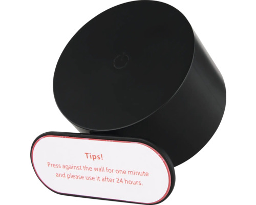 Schwarzer, zylinderförmiger Klebegegenstand mit Hinweisschild