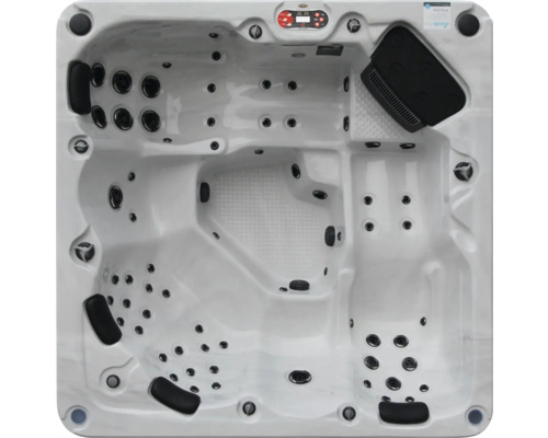 Ansicht von oben auf einen Whirlpool mit mehreren Sitzen und Düsen